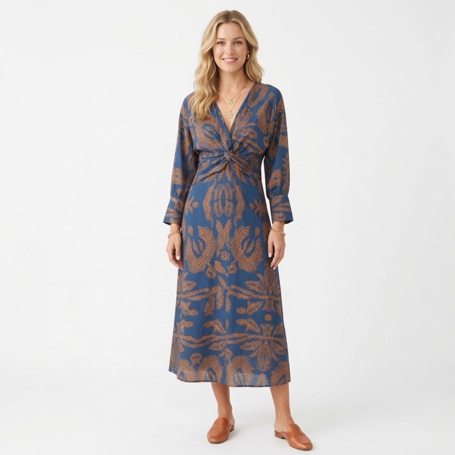 Női midi ruha hosszú ujjakkal, elülső masnival és mintával