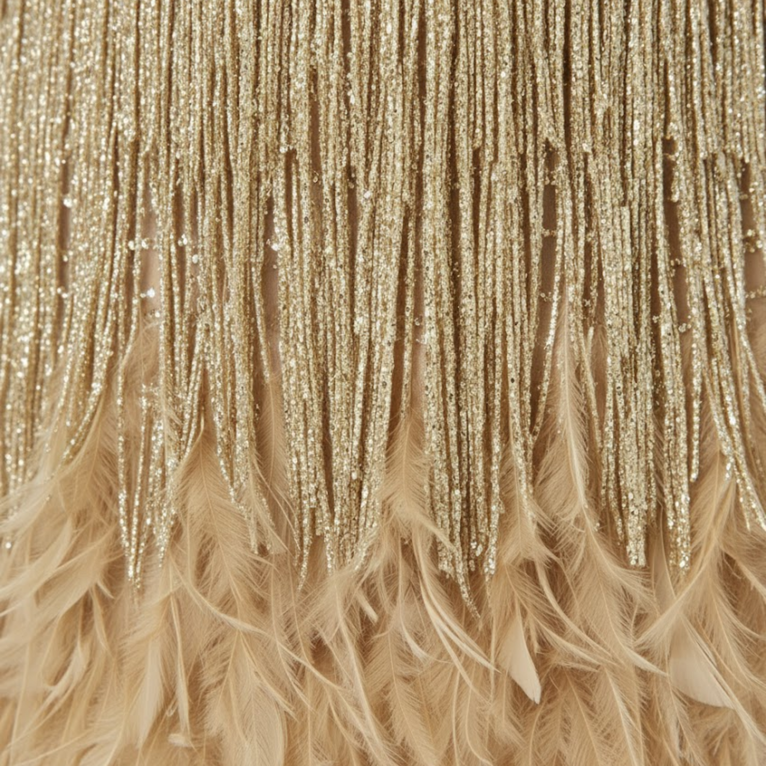 Evening gown with sequins and feathers, V-neckline, and thin straps