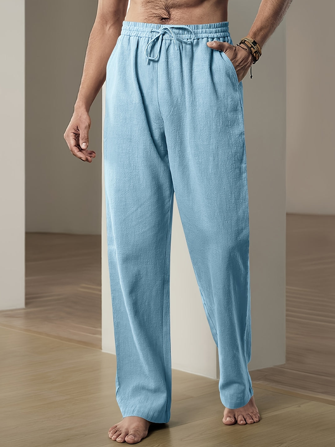 Pantaloni uomo in lino con vita elasticizzata e taglio fluido