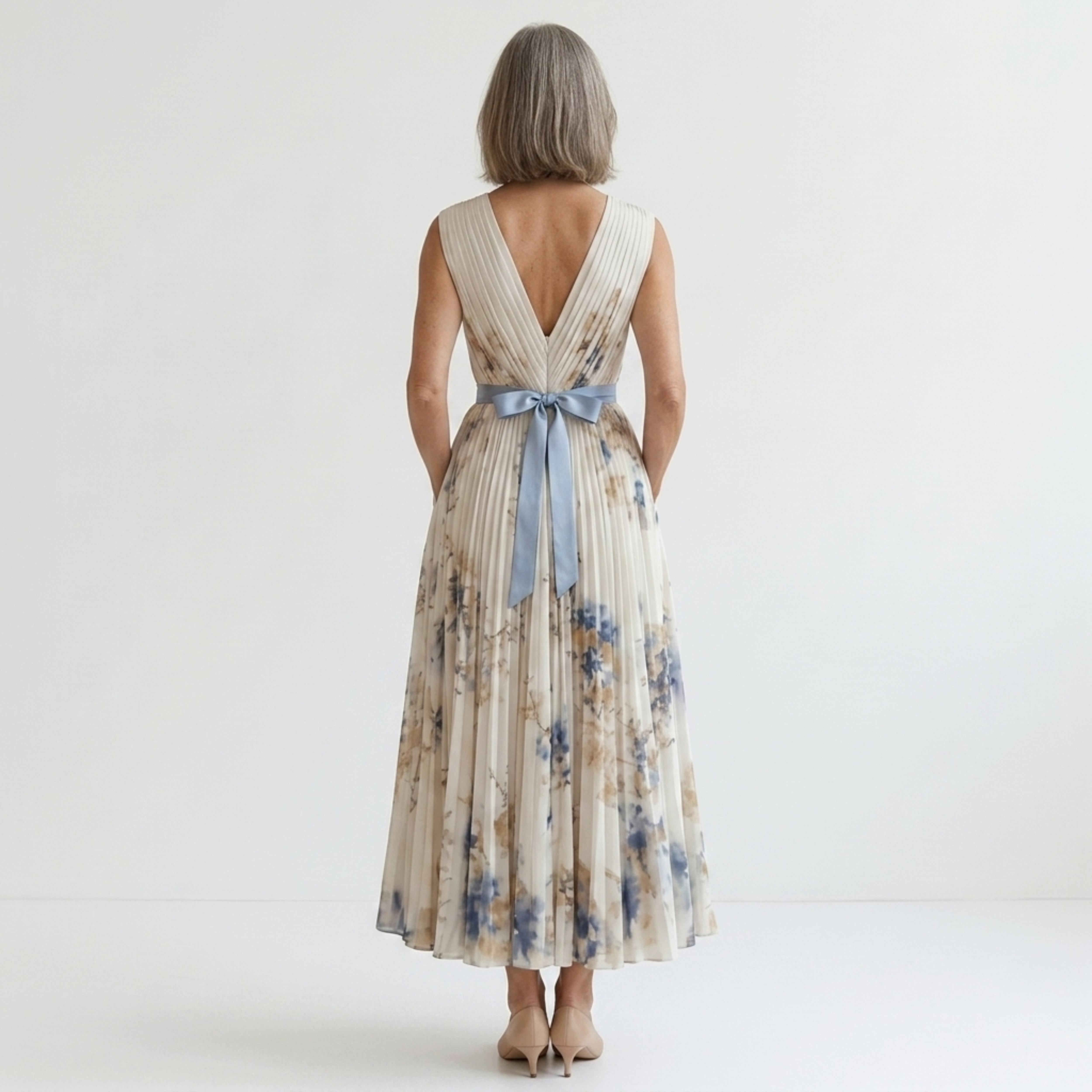 Mid-length floral dress — V-neck and pleated skirt with pockets — vacation