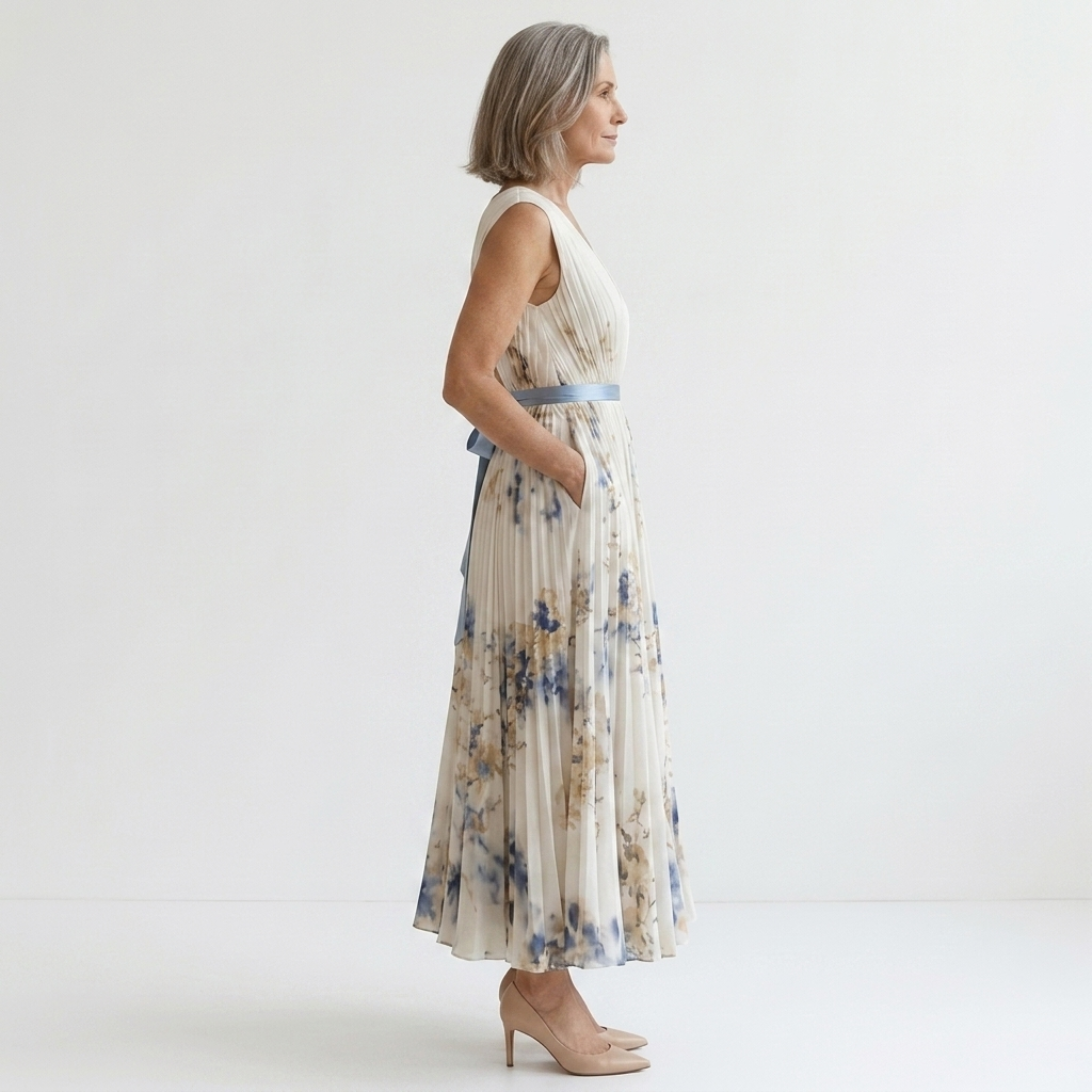 Mid-length floral dress — V-neck and pleated skirt with pockets — vacation