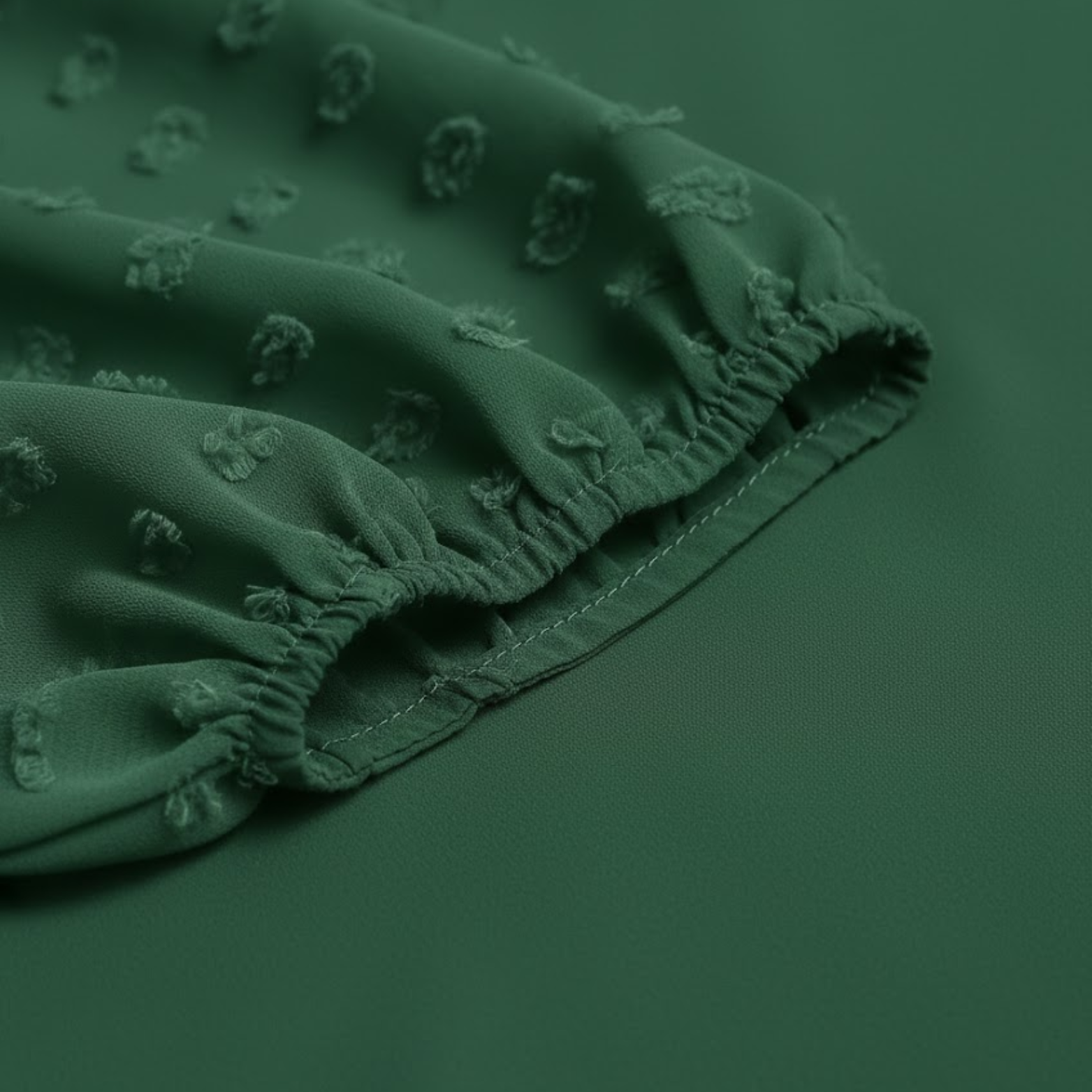 Women's blouse with V-neck, puffed textured sleeves, dotted sheer fabric, flowing