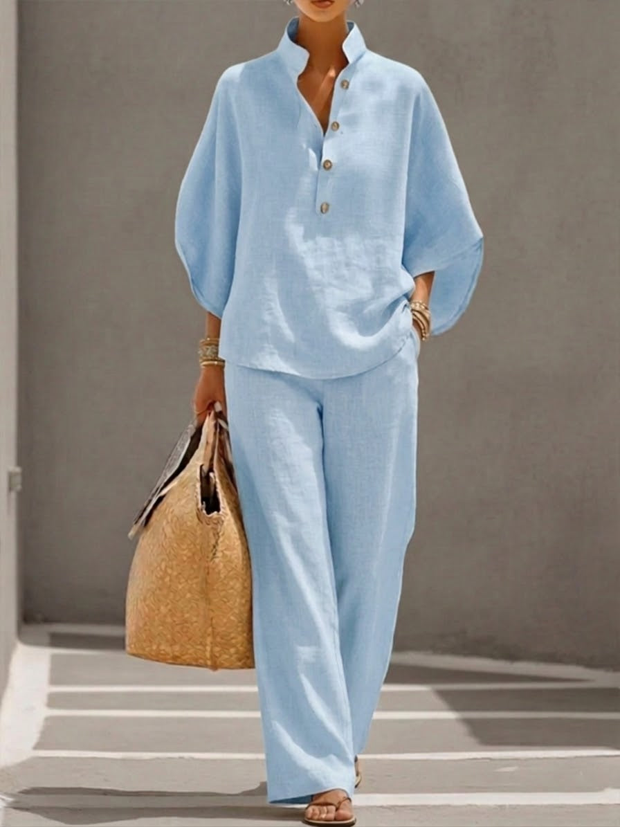 Women's suit with loose top, batwing sleeves, and straight pants