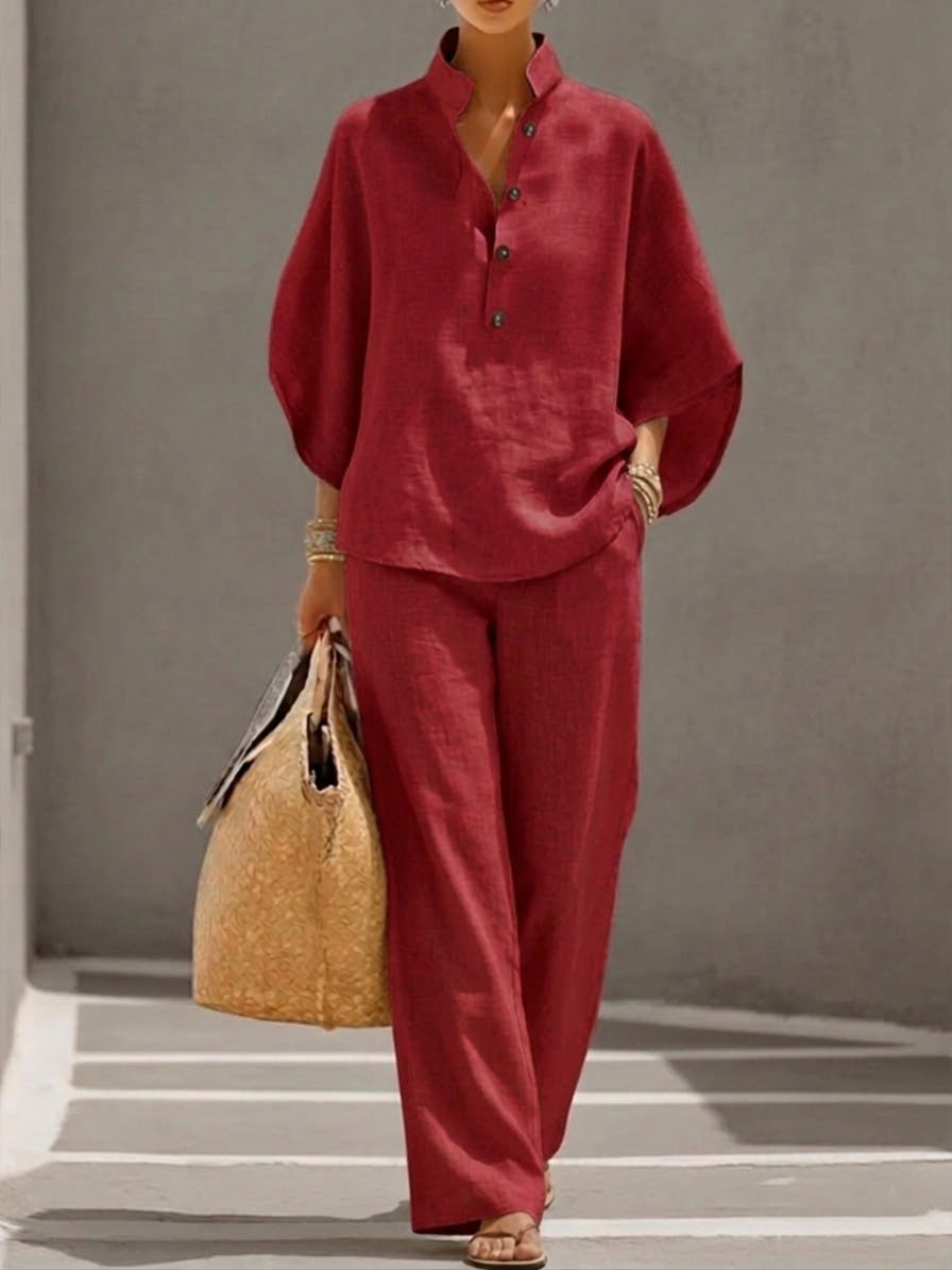 Women's suit with loose top, batwing sleeves, and straight pants