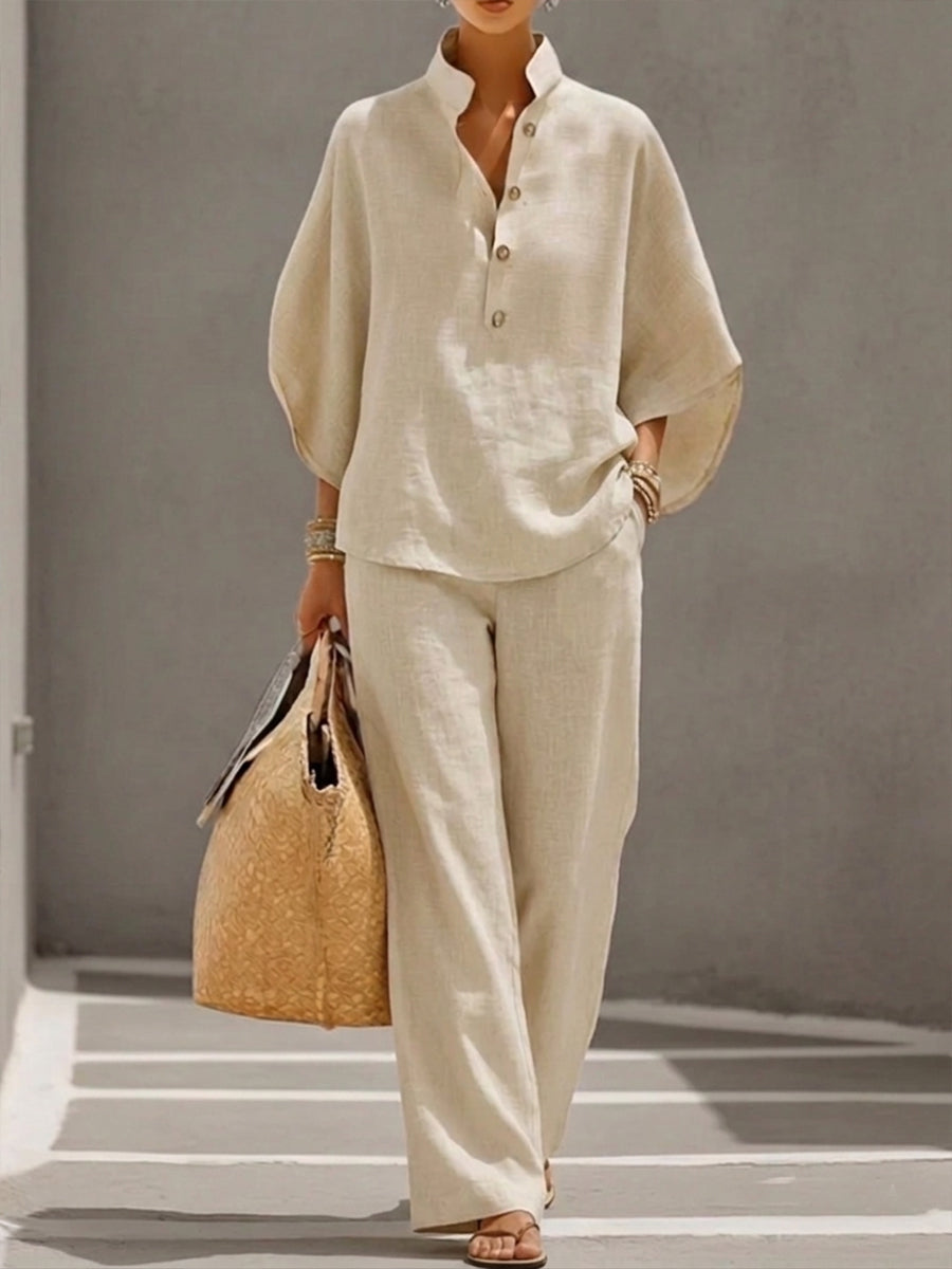 Women's suit with loose top, batwing sleeves, and straight pants